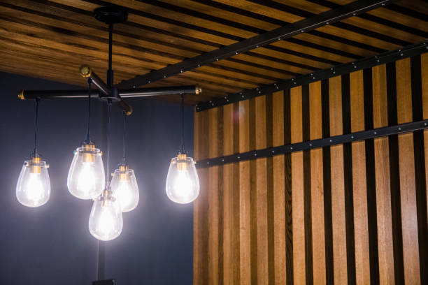 istock Modern chandelier and wood wall 1360618485
