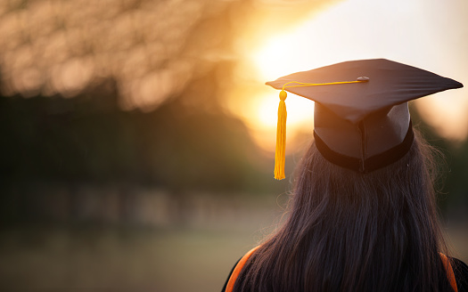 Japanese woman, graduation and portrait with certificate for achievement with pride, success and celebration. Asian university student, girl or person with diploma, happy and outdoor at campus event