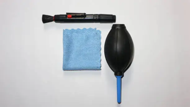 Photo of Complete package of camera cleaning tools, namely water bowler, lenspen brush and micro fiber cloth for canon eos nikon fujifilm sony samsung panasonic mirrorless and DSLR