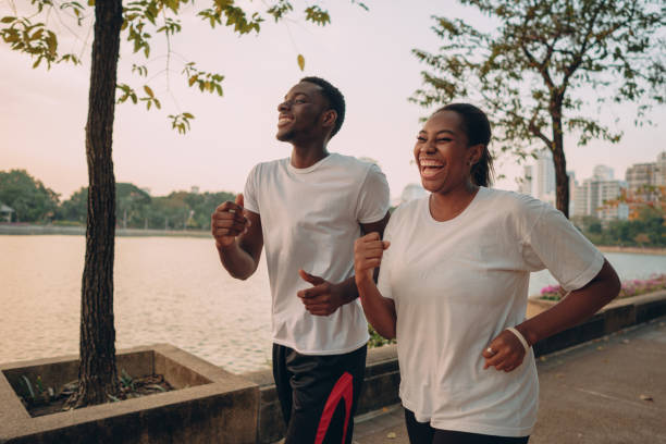 istock Friends jogging in the park 1360624744