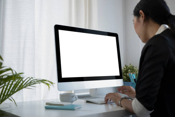 istock Asian businesswoman working with computer at her workplace. 1360629509