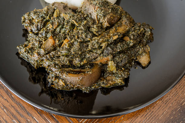 istock Nigerian Pounded Yam served with Afang soup ready to eat 1360632769