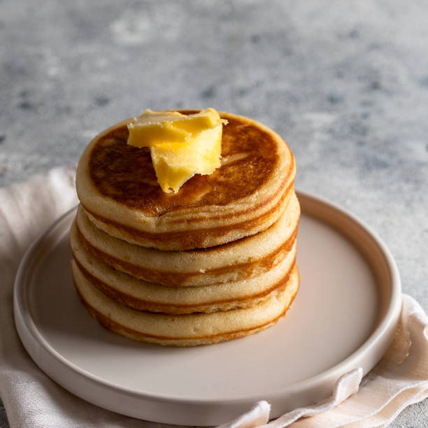 istock American Breakfast Pancakes with butter on light background for classic breakfast.Copy space 1360632786