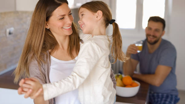 istock Family at home starting their day in the kitchen dancing 1360632873