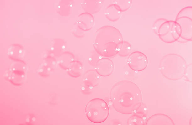 istock Beautiful Transparent Pink Soap Bubbles Natural Background. Celebration, Wedding Card. Blurred Pink Bubbles Backdrop. Valentine Pink Wallpaper. 1360632936