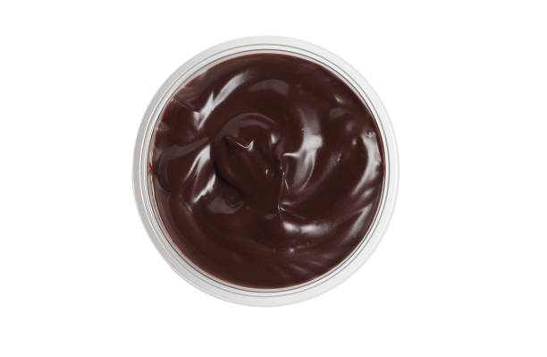 istock Chocolate cream in plastic cup on white background 1360633969