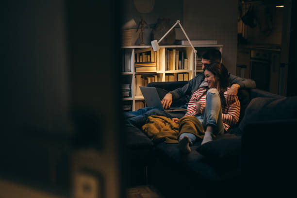 istock young couple enjoying time at home. evening night scene 1360635271