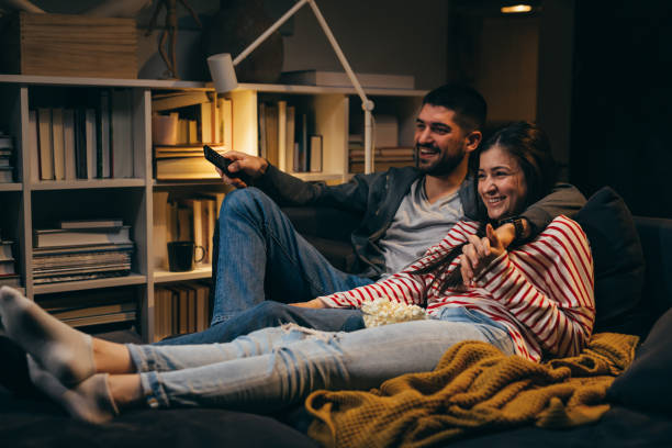 istock young couple enjoying time at home. evening night scene 1360635275