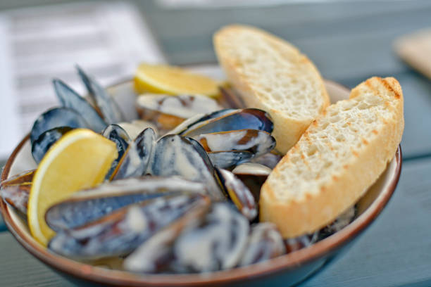 Mussels in a creamy sauce, restaurant serving.