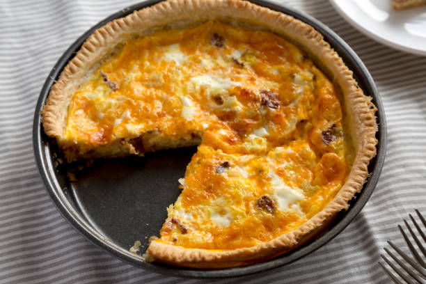 istock Homemade Bacon Quiche with Eggs and Cheddar Cheese, side view. Close-up. 1360643546
