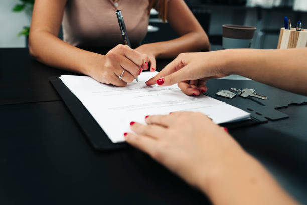 istock contract signing at desk details 1360643694