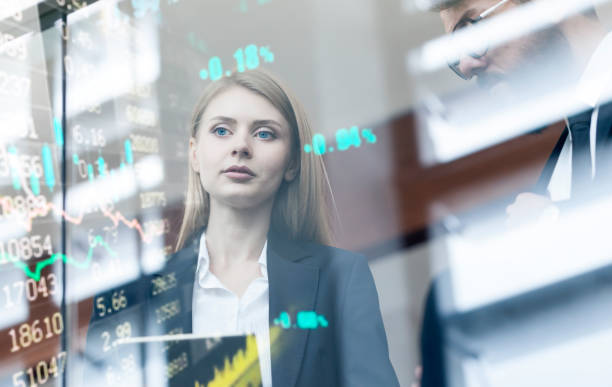 istock Busineswoman watching stock market data on a modern interface 1360651134