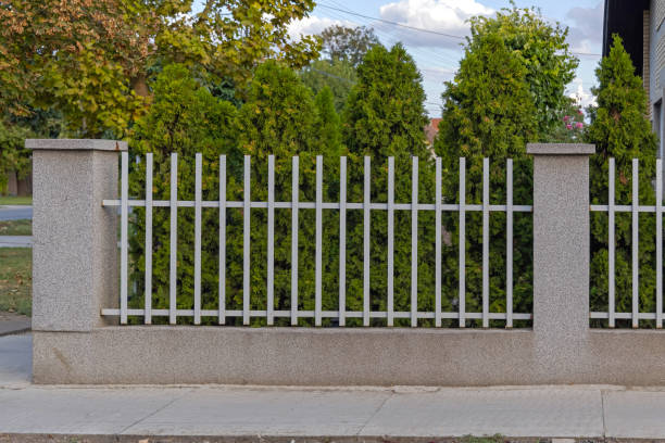 istock White Metal Fence 1360657280