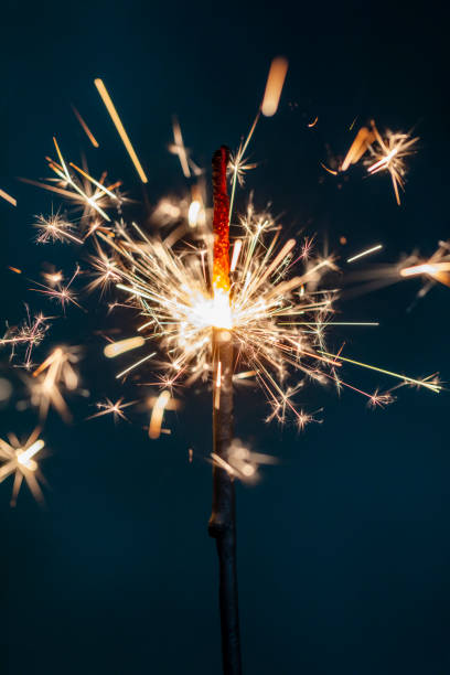 istock Christmas bengal fire sparkles against the black background. 1360658519