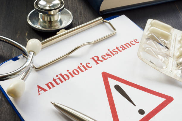 Antibiotic resistance sign and pills on it. Antibiotic resistance sign and pills on it. antibiotic resistant photos stock pictures, royalty-free photos & images