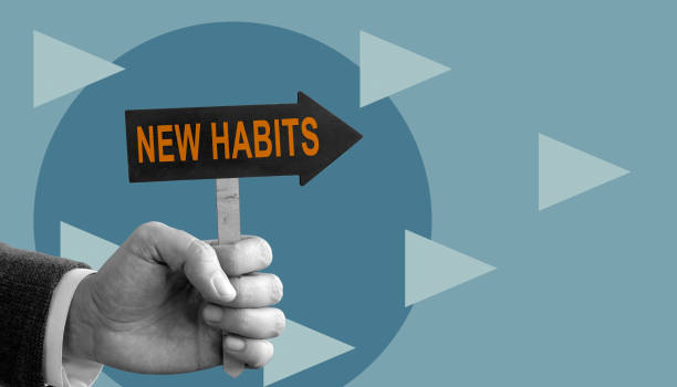 istock The hand holds a pointer to new habits. 1360661495