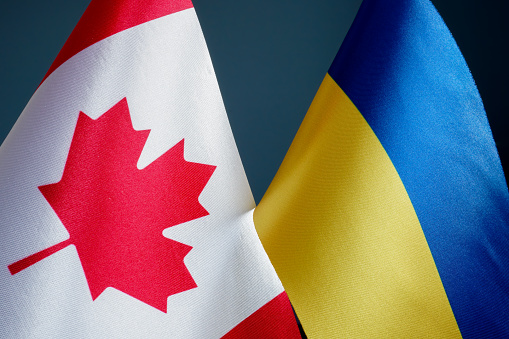 Close up of flags of Canada and Ukraine.
