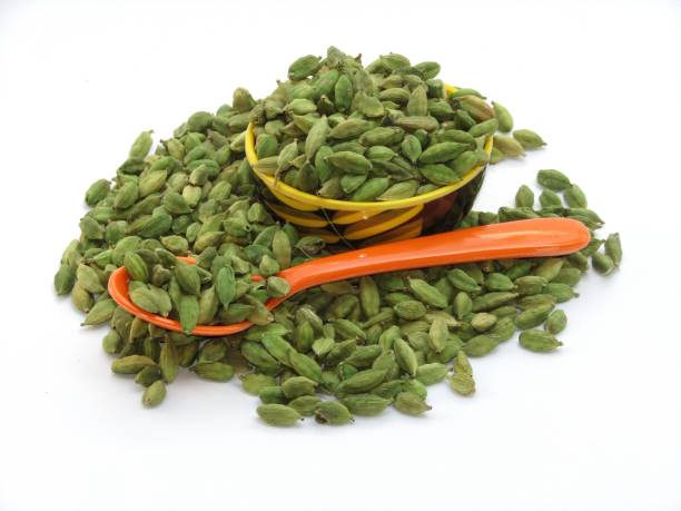 istock Cardamom in a bowl on white background 1360662630