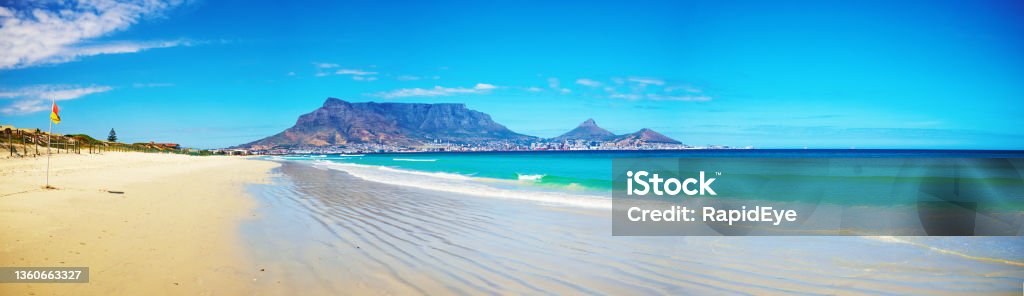 Beautiful classic view of Table Mountain, Cape Town, South Africa on a glorious sunny summer day Table Mountain, with the city of Cape Town nestling beneath it, seen from across Table Bay at Milnerton. South Africa Stock Photo
