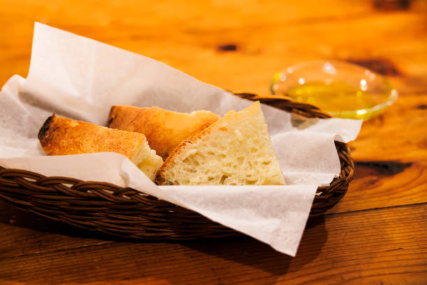 French bread placed on an antique wooden table