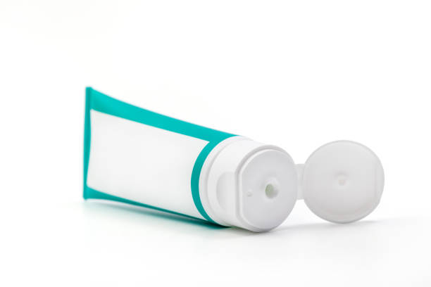 Cosmetic cream green tube. Sskincare cosmetic package. Plastic toothpaste tube. Product in green tubeisolated on white background. Clipping path included.