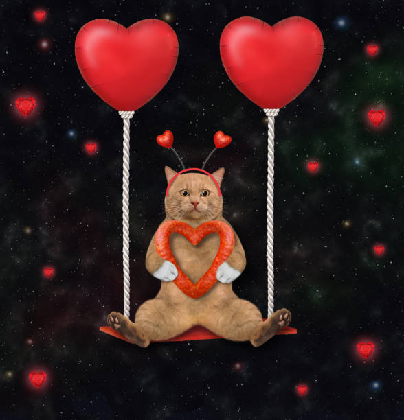 istock Cat reddish swinging on red balloons 1360667720