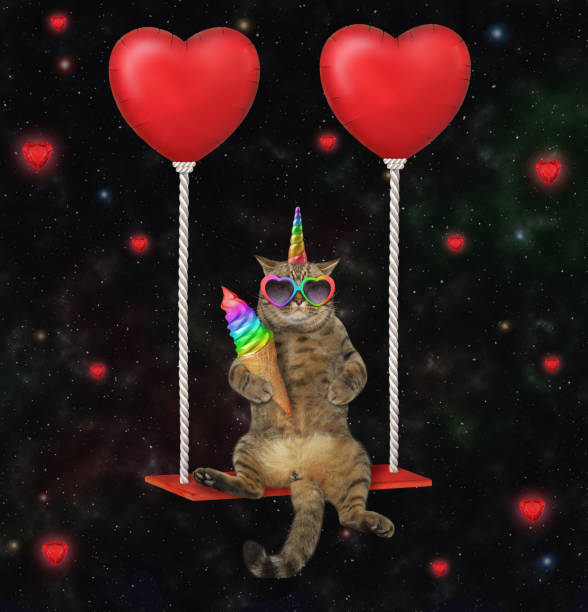 istock Caticorn swinging on red balloons 1360667724