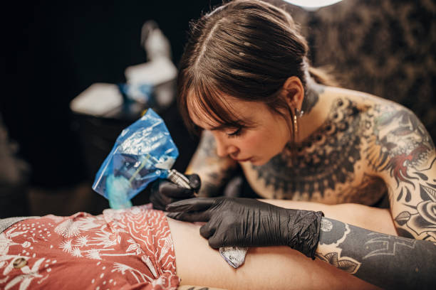 istock Beautiful female tattoo artist 1360671103