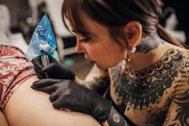 istock Beautiful female tattoo artist 1360672015