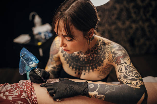 istock Beautiful female tattoo artist 1360672207