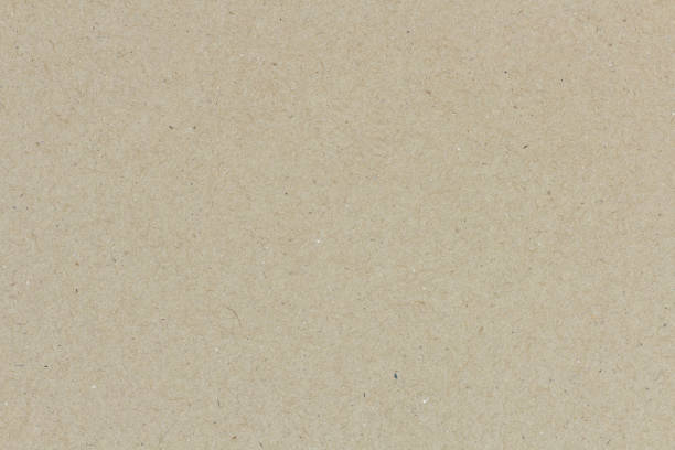istock paper background texture light rough textured spotted blank copy space background in yellow,brown 1360673241