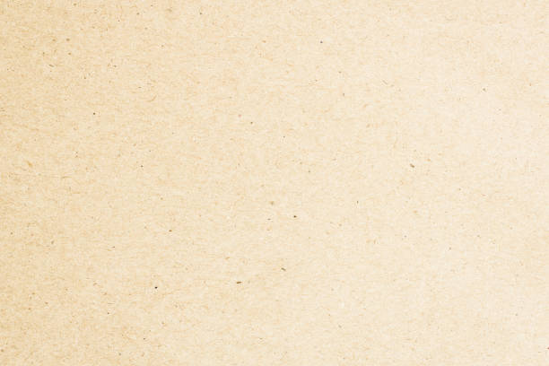 istock paper background texture light rough textured spotted blank copy space background in beige yellow,brown 1360673254