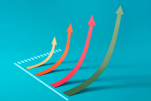 Four arrow head chart lines moving upwards on blue background.
