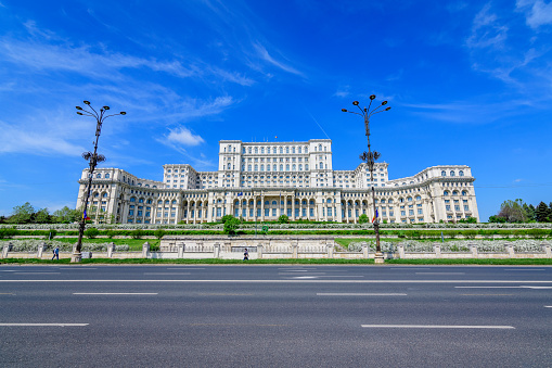 The Palace of the Parliament also known as People's House (Casa Popoprului) in Constitutiei Square (Piata Constitutiei) in Bucharest, Romania, in a sunny spring day