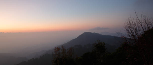 istock Beautiful view of mountains and white mist 1360677055