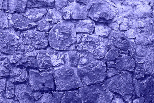 Purple ancient stone wall texture background. stock photo