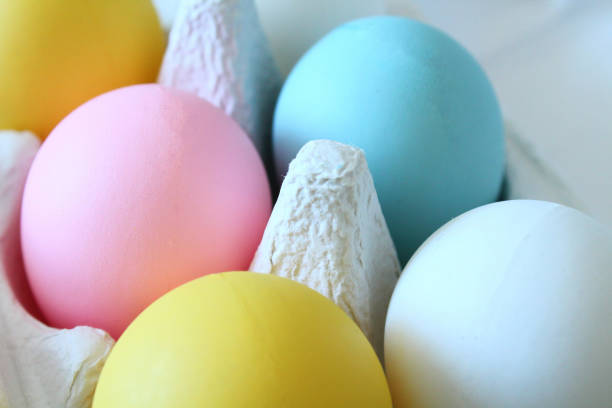 colored easter eggs in a box. close-up. background. - chicken egg audio imagens e fotografias de stock