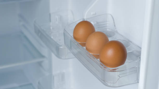 istock Organic chicken eggs in the egg compartment in the refrigerator. Chicken egg is one of the food ingredients. 1360680944