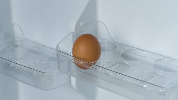 istock Organic chicken eggs in the egg compartment in the refrigerator. Chicken egg is one of the food ingredients. 1360681009