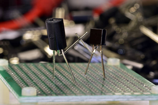 istock Two low-power silicon transistors do boxing or fencing 1360681265