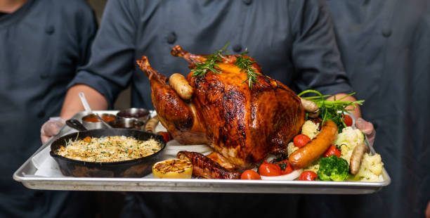 istock The cook carried the turkey 1360683282