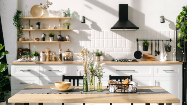 istock Spacious and bright kitchen interior with modern decorations and food 1360685201