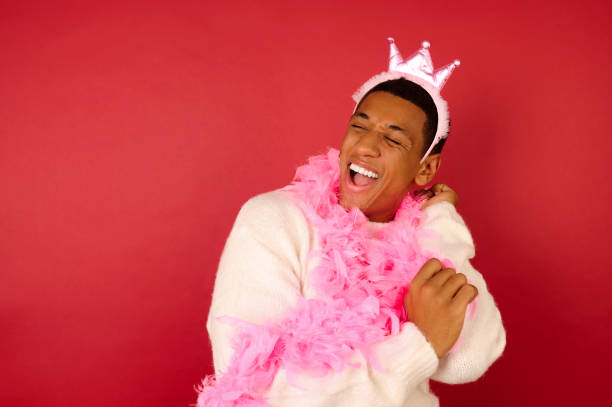 istock A dark-skinned young ma in a crown and with a pink garland 1360689143