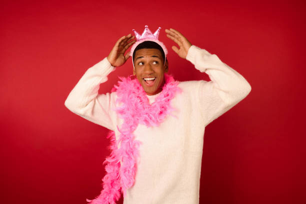 istock A dark-skinned young ma in a crown and with a pink garland 1360689148