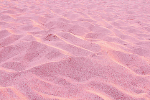 Red beach sand. Background. Texture.