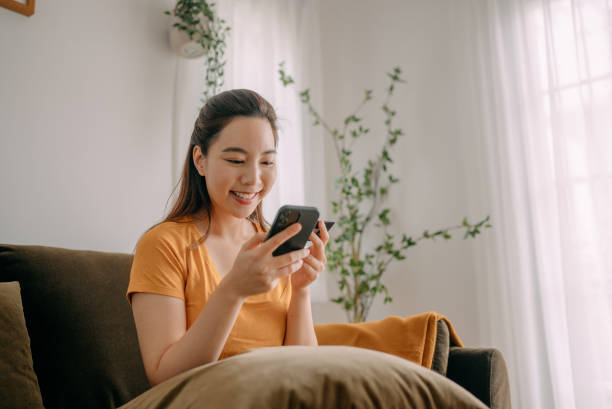 istock Young woman Using credit card payment 1360690291
