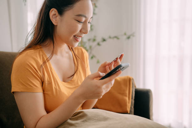 istock Young woman Using credit card payment 1360690308