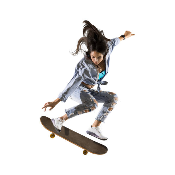 Skateboarder doing a jumping trick Skateboarder doing a jumping trick. Freestyle extreme sports concept isolated on white background skateboard stock pictures, royalty-free photos & images