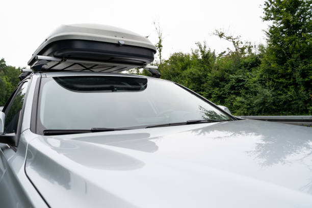 istock Silver colored car with roof box during a trip 1360693035