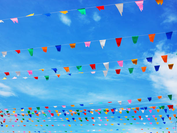 istock Multi colored pennant decoration over street in Sukhothai 1360695422